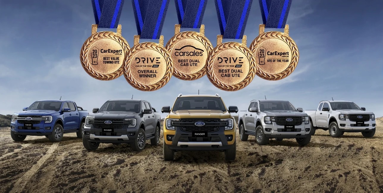 Five Ford Rangers parked in off-road environment. 