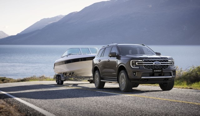 Blue Ford Everest towing a boat out of the water